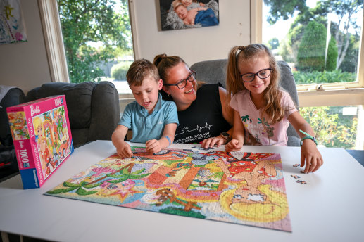 Keen jigsaw puzzler Alannah Jenkins, 30, and her children, Elouise, 6, and Noah, 4.