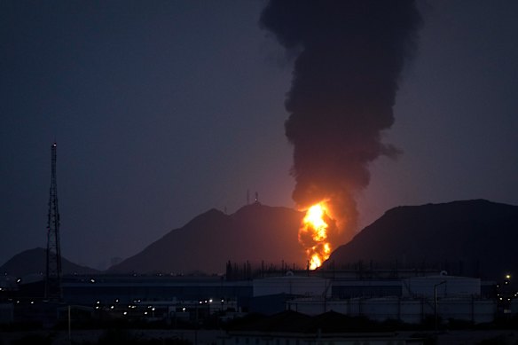 Large fire and plume of smoke is visible after, according to the authorities, debris of an Iranian intercepted drone hit the Fujairah oil facility, in Fujairah, the United Arab Emirates.