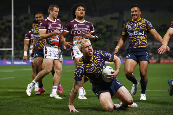Melbourne’s Cameron Munster celebrates after scoring a try against Manly.