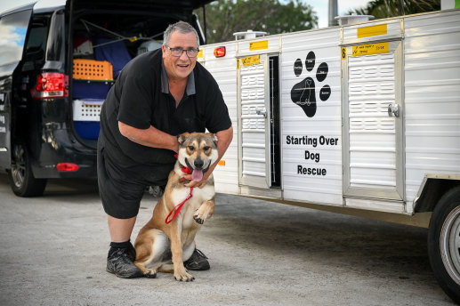 Good luck, mate: Volunteer driver Bill Maher, having driven stray dog Fairie from Swan Hill, hands her over to rescue volunteers on Melbourne’s outskirts.