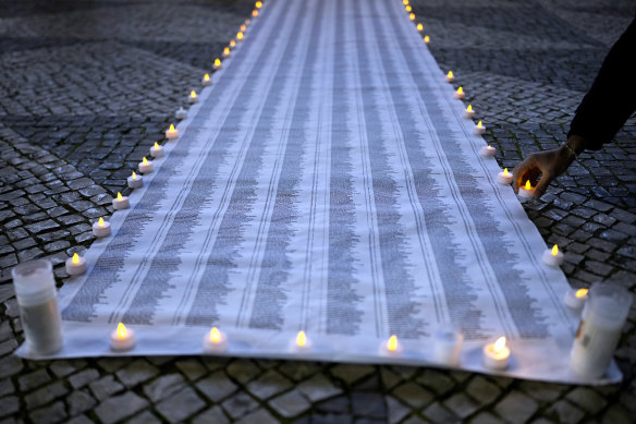 A list with the names and ages of victims of the war in the Gaza Strip at a vigil for Palestinians that called for a ceasefire in Lisbon on Wednesday.