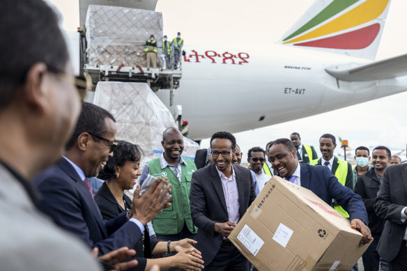 Ethiopia's national coronavirus co-ordinator, Dr Shumete Gizaw (centre right) with medical supplies from a shipment sent to Addis Ababa on Sunday.