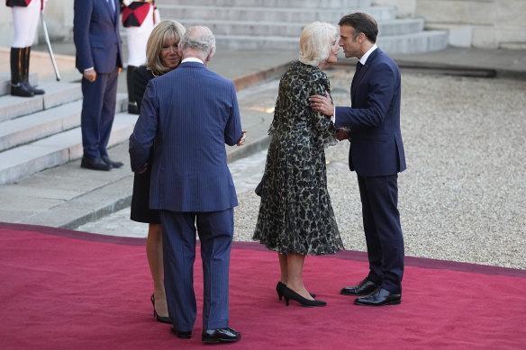 King Charles farewells France’s first lady Brigitte Macron (left), while French President Emmanuel Macron kisses Queen Camilla, as the royals leave the Elysee Palace in September.