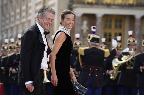 Hugh Grant, left, and wife Anna Elisabet Eberstein arrive at the star-studded state banquet.
