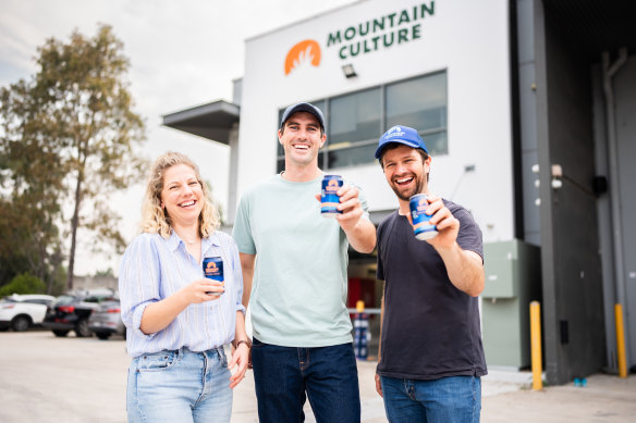 Pat Cummins (centre) with Mountain Culture Beer Co founders Harriet and D.J. McCready.