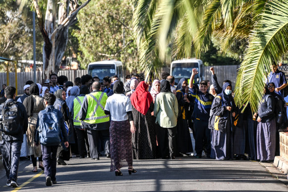 Protesters outside the college last Friday voiced their support for the former principal and assistant principal, who were both stood down by the board.