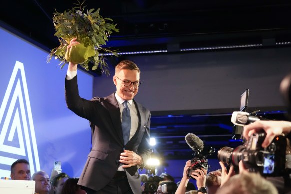 Alexander Stubb celebrates after winning the presidential election runoff.