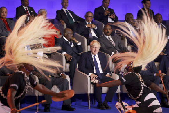 Ruffled: British Prime Minister Boris Johnson, centre, looks at traditional dancers performing during the opening ceremony of the Commonwealth Heads of Government Meeting (CHOGM) in Kigali, Rwanda.