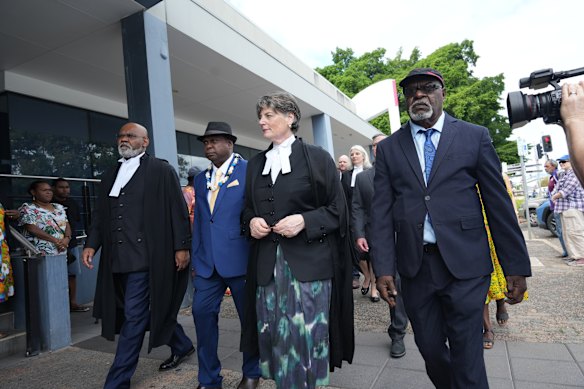 Torres Strait Island elders Uncle Pabai Pabai and Uncle Paul Kabai at court with their legal advisers. 