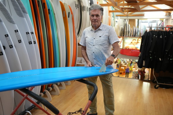 Natural Necessity surf shop owner Kent Ladkin has noticed a softening in consumer spending over the past months but believes tourism spending is holding up. 