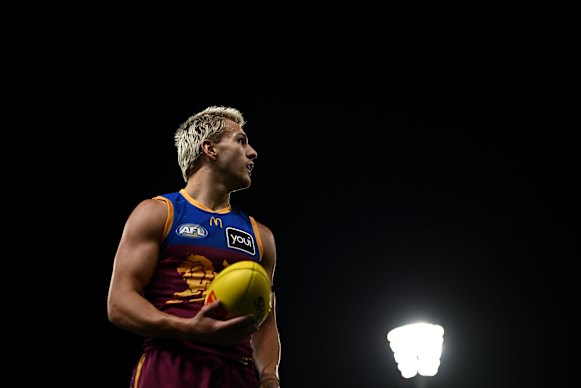 Kai Lohmann looks on before kicking a goal.