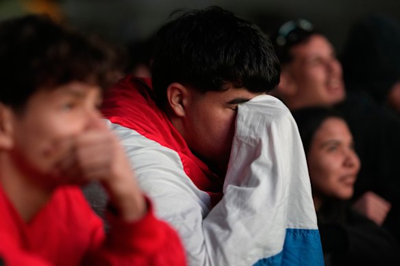 Paraguay fans react to the loss. 
