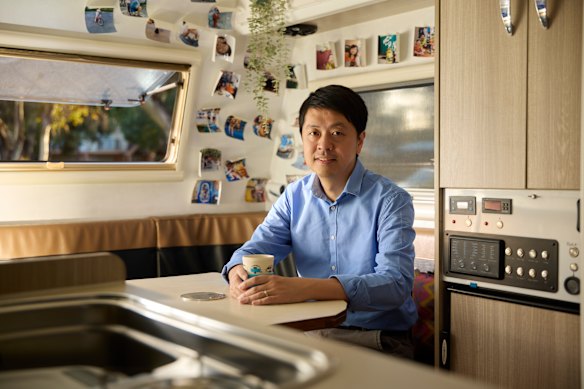 Ted Hui inside his secondhand caravan. “It’s the most Aussie thing I do here,” he says.