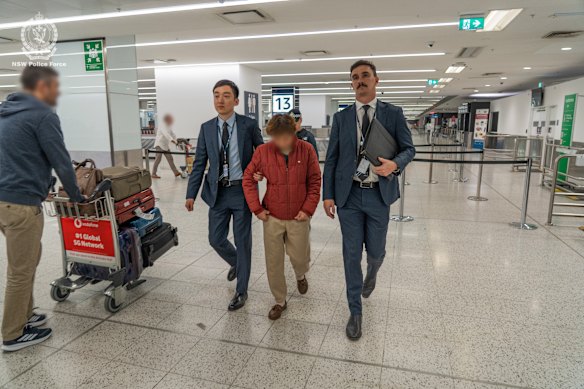 The 63-year-old woman was arrested at Sydney International Airport on Thursday evening. 
