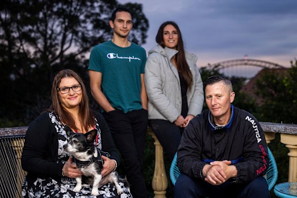 Jeremy, seated at right, with his host family.