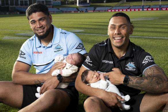 Baby Sharks doo-doo doo-doo doo-doo the right thing:  Oregon Kaufusi with two-week-old Estelle, and Jesse Ramien with one-week old Tallen.