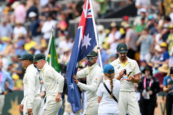 The Test team with the Australian flag at the Gabba during the series against South Africa in 2022.
