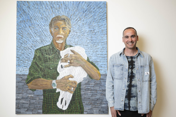 Mostafa Azimitabar with his portrait of artist and friend Angus McDonald, which is a finalist in the Archibald Prize at the Art Gallery of NSW.