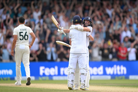 Chris Woakes and Mark Wood celebrate.