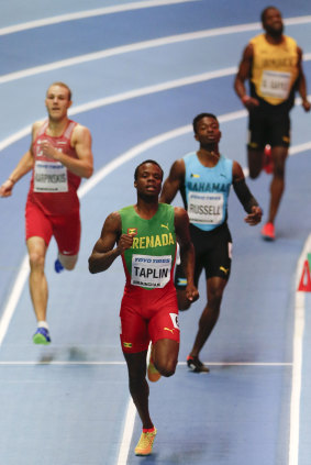 Cooled off: Grenada's Bralon Taplin leads in a men's 400 metre heat at the World Athletics Indoor Championships in Birmingham.