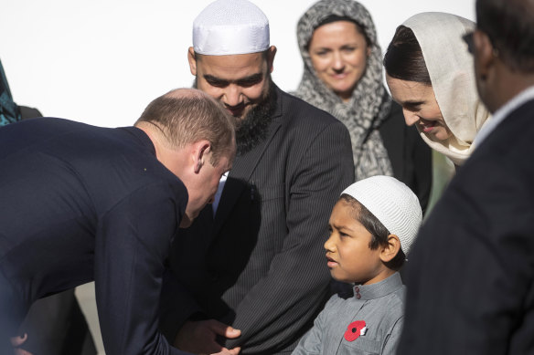 Prince William, left, meets a young Muslim community member and New Zealand Prime Minister Jacinda Ardern, second right, at the Al Noor mosque in Christchurch last month.