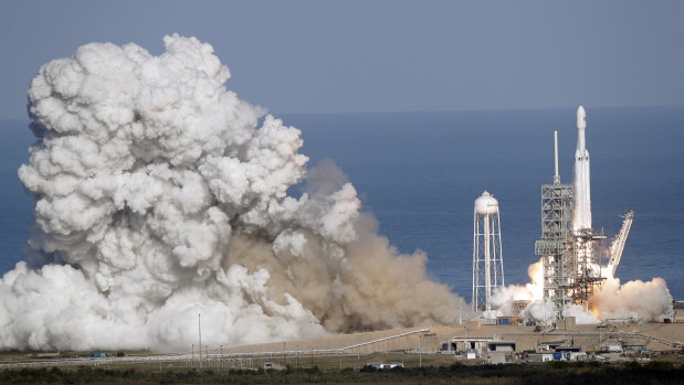 A Falcon 9 SpaceX heavy rocket lifts off from the Kennedy Space Center in Cape Canaveral.
