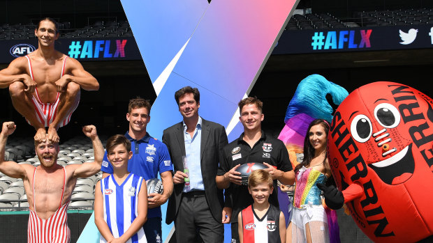 Bring on the circus: AFL boss Gillon McLachlan, centre, has hit on a marketing coup. 