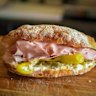The Bologna with mortadella, stracciatella, pickled peppers and olives.