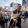 Yoorrook commissioner Travis Lovett leading the truth walk to the steps of parliament on June 16.