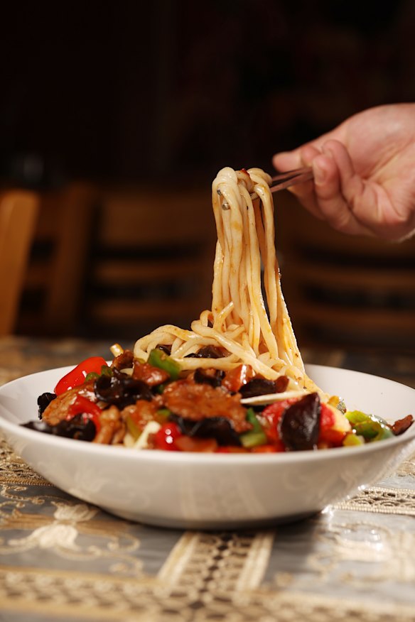 The signature lagmen stir fry with bouncy hand-pulled noodles.
