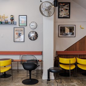 There are a few seats inside the cosy cafe.