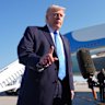 US President Donald Trump speaks to reporters in Palm Beach on Monday.