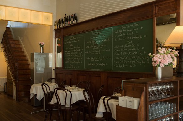 Bar Carnation’s daily menu is chalked up on the specials board.
