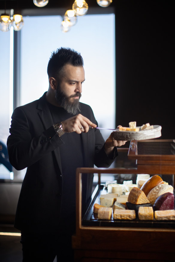 Rajnor Soin pictured with the all-Australian cheese trolley at Vue de Monde.