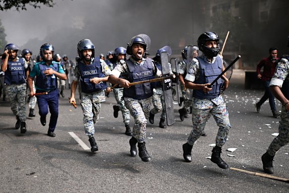 Police disperse protesters outside Bangladesh’s national parliament complex in Dhaka, Bangladesh.