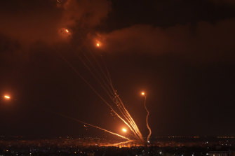 Palestinian officials say Israeli airstrikes on Gaza have killed at least 10 people, including a senior militant, and wounded 55 others. In this picture, Palestinian militants launch rockets toward Israel.