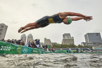 Emma Jeffcoat dives into the water on day four of the women’s individual triathlon on Tuesday.