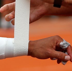 The wrist in question: Nadal gets treatment during the quarter-final.