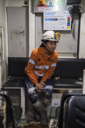 Engineer Jaime Cheuk sits in the 'manrider' vehicle as it travels towards the end of the metro tunnel.