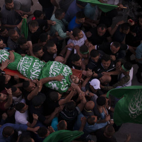 Palestinian mourners carry the body of Nidal Safadi, who was killed in clashes with Israeli forces, during his funeral in the West Bank village of Urif, near Nablus, on Friday.