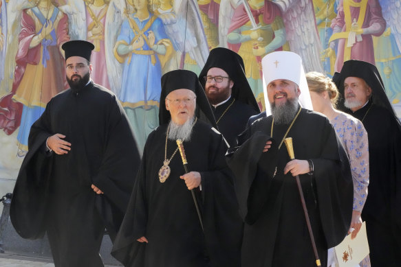 Ecumenical Patriarch Bartholomew I, centre, accompanied by the head of the Ukrainian Church Metropolitan Epiphanius, right, visits the Mikhailovsky Zlatoverkhy Cathedral in Kyiv, Ukraine in 2021.