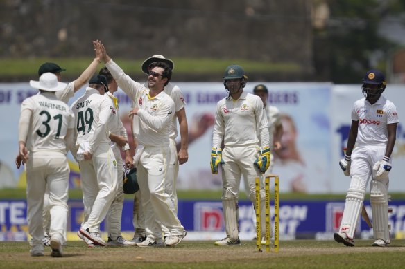 Australian spinner Travis Head celebrates a Sri Lankan wicket on Friday.