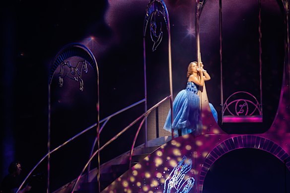 Laufey twirls, claps, and bounces in a blue dress straight from a fairytale book