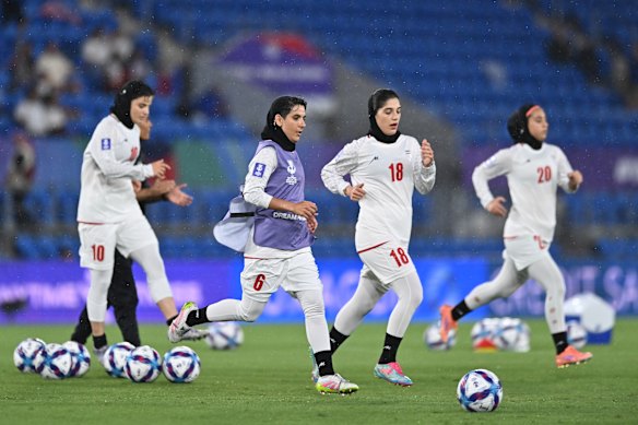 Iranian players warming up on Sunday night.