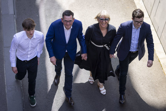 Daniel Andrews leaving Tuesday’s press conference flanked by his sons and wife, Cath. 