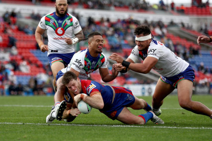 Lachlan Fitzgibbon crosses for the Knights’ opening try.