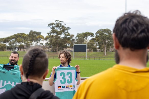 Andrew Bottriell (middle) who coaches the Kangas as part of his homeless and community support worker role at CoHealth.
