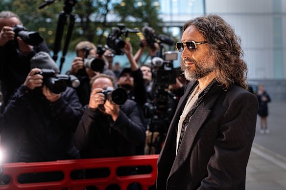 Brand was met on Wednesday by a crowd of photographers and journalists.
