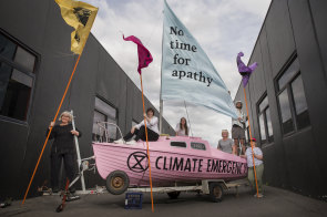 Setting out to protest: Extinction Rebellion protesters prepare props in Thornbury. 