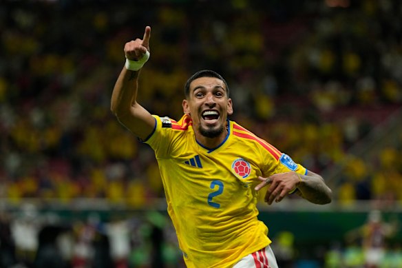 Daniel Munoz celebrates after scoring his side’s opening goal.